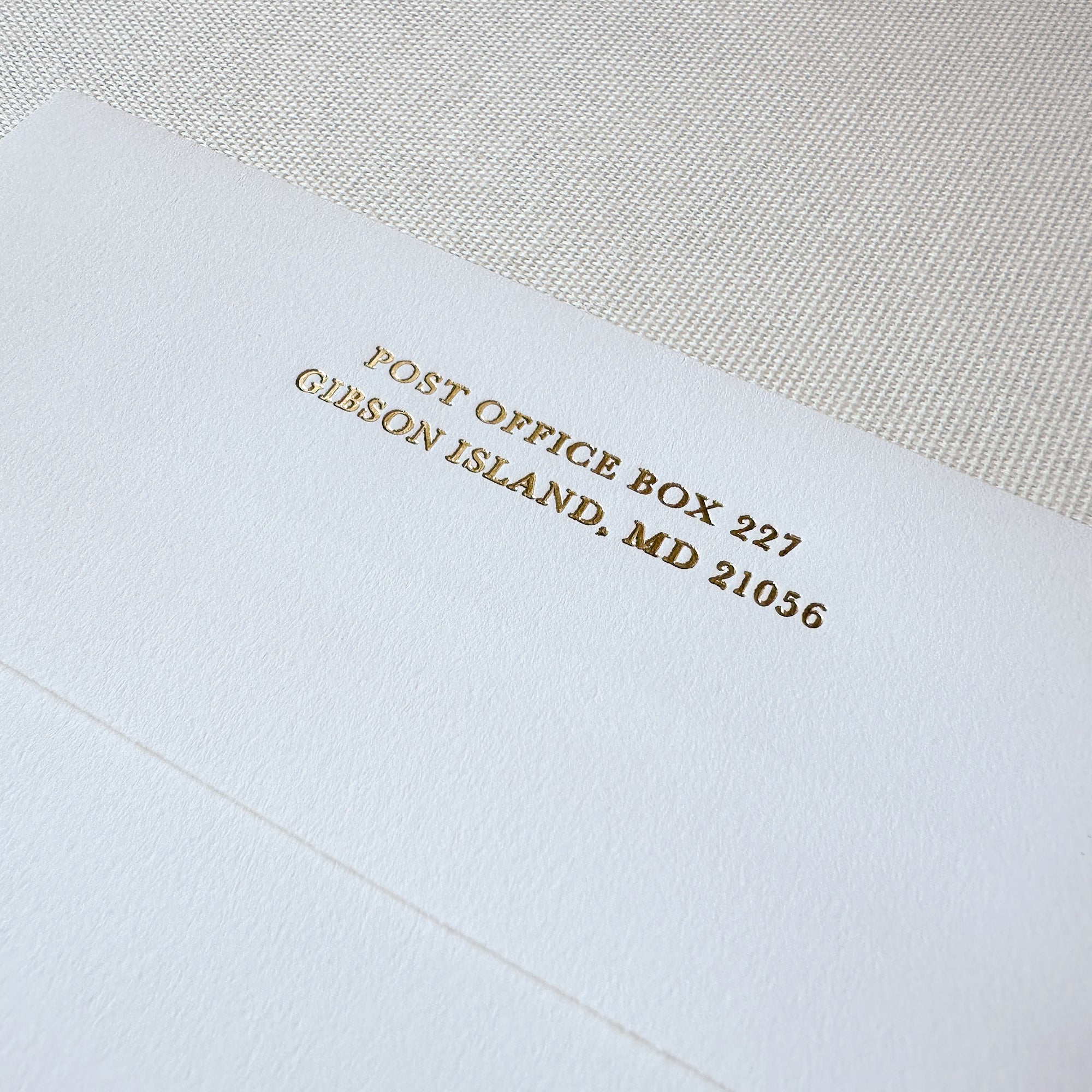 White Envelope with Gold Foil Printing Angle